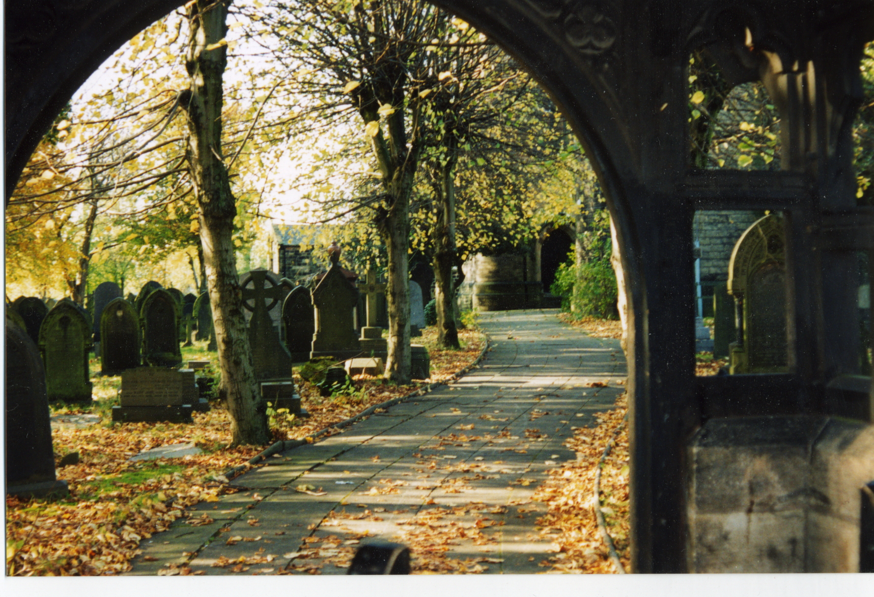 View of lychgate and graveyard